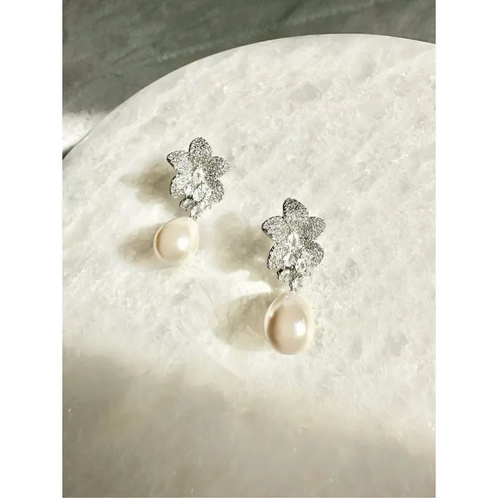Cubic zirconia pearl orchid dangle earrings ￼
